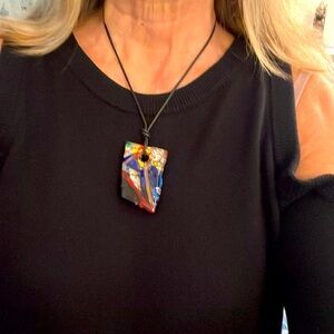 Pendant on a black cord